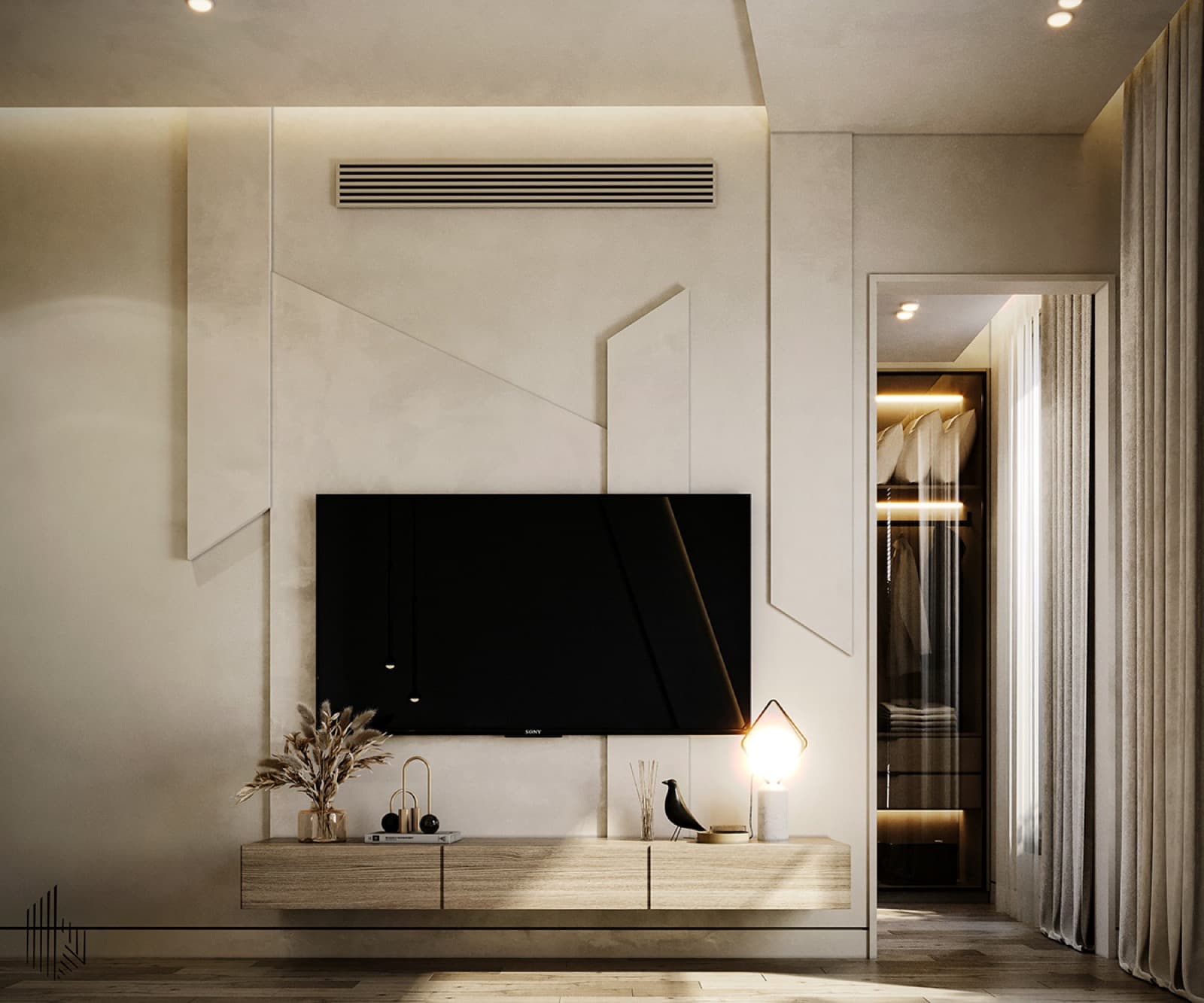 A bedroom interior with soft upholstery and carefully arranged decorative finishes.